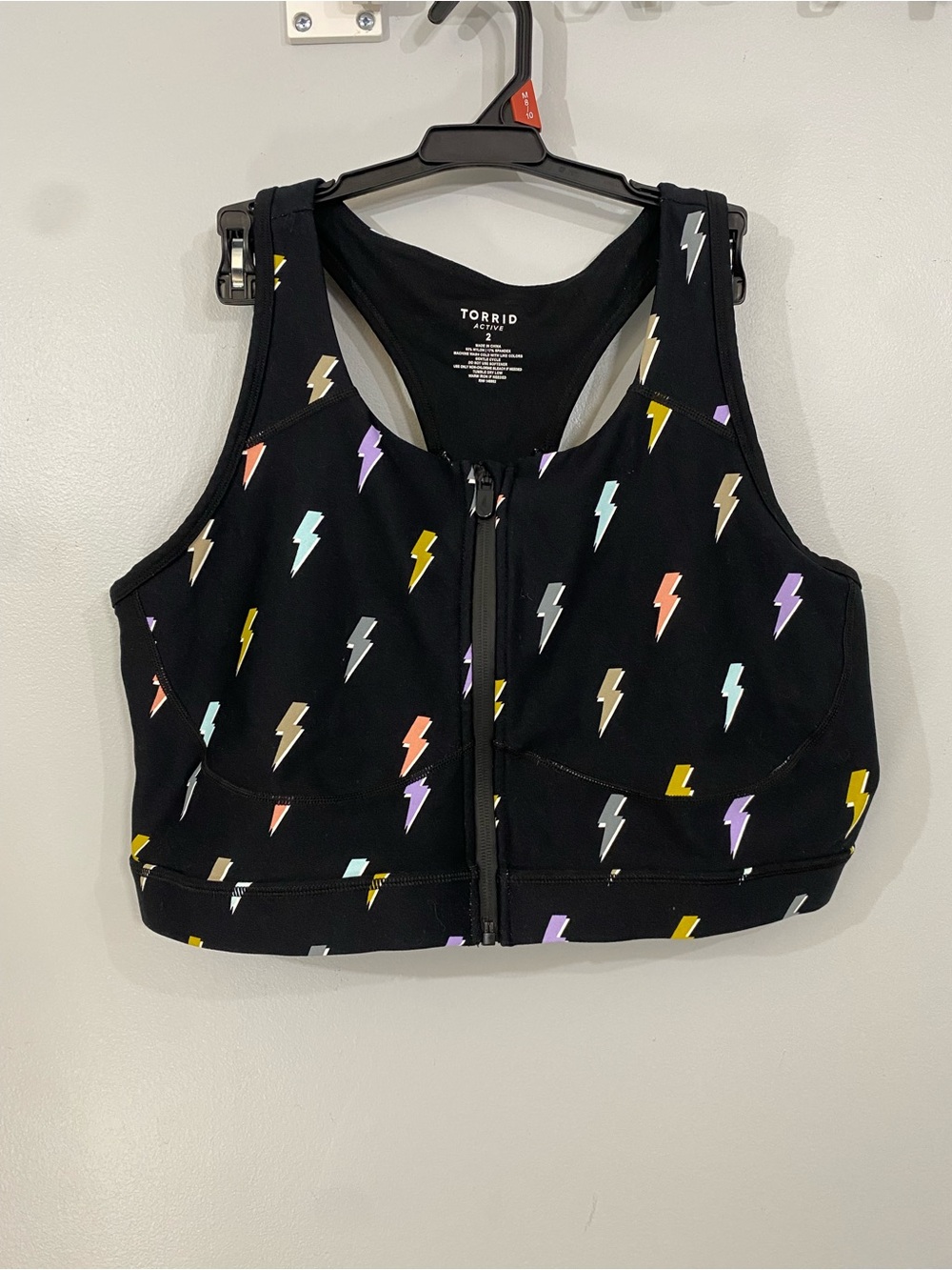 torrid Black Lightning Bolt Front-Zip Sports Bra with Multicolor Bolts